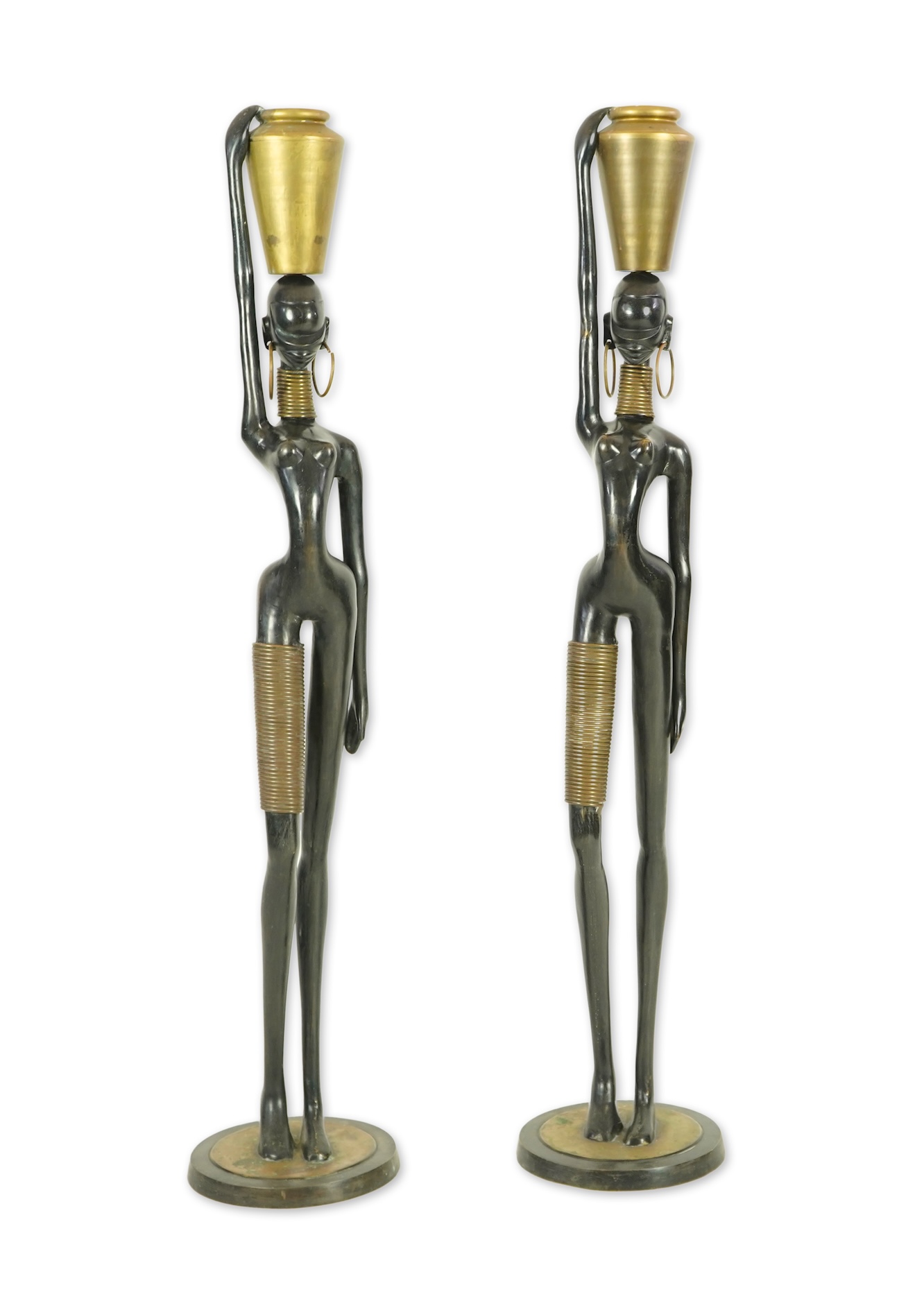 A large pair of Hagenauer style ebonised bronze 'Giraffe Woman' figures